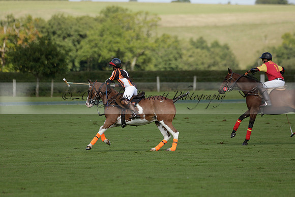 Four Quarters Black (black) v BHC (red) in a Autumn Cup polo match on Ambersham 2 at Cowdray Park Polo Club on Friday 20 September 2013 www.polopictures.co.uk