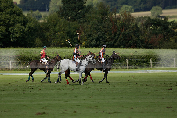 Four Quarters Black (black) v BHC (red) in a Autumn Cup polo match on Ambersham 2 at Cowdray Park Polo Club on Friday 20 September 2013 www.polopictures.co.uk