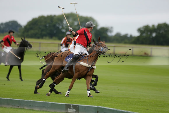 Four Quarters Black (black) v Clashleigh (red) in the Autumn Cup subsidiary final polo match on Ambersham 2 at Cowdray Park Polo Club on Sunday 22 September 2013 www.polopictures.co.uk