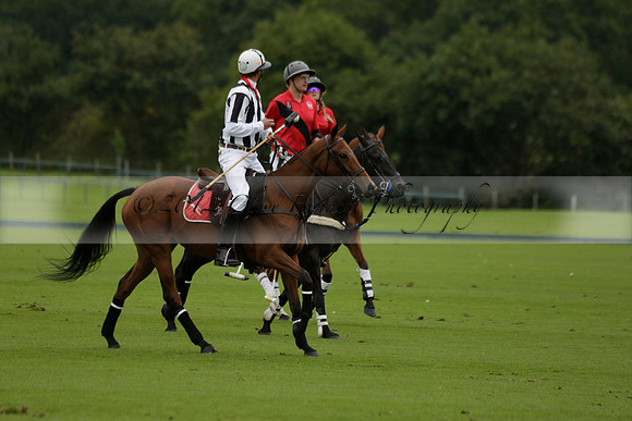 Four Quarters Black (black) v Clashleigh (red) in the Autumn Cup subsidiary final polo match on Ambersham 2 at Cowdray Park Polo Club on Sunday 22 September 2013 www.polopictures.co.uk
