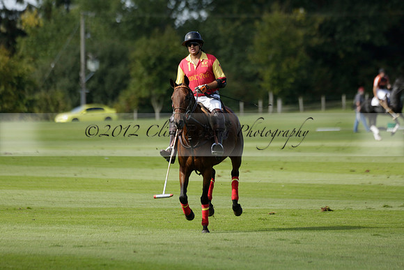 Four Quarters Black (black) v BHC (red) in a Autumn Cup polo match on Ambersham 2 at Cowdray Park Polo Club on Friday 20 September 2013 www.polopictures.co.uk