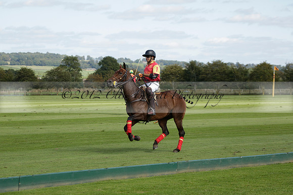 Four Quarters Black (black) v BHC (red) in a Autumn Cup polo match on Ambersham 2 at Cowdray Park Polo Club on Friday 20 September 2013 www.polopictures.co.uk
