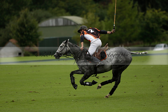 Four Quarters Black (black) v Clashleigh (red) in the Autumn Cup subsidiary final polo match on Ambersham 2 at Cowdray Park Polo Club on Sunday 22 September 2013 www.polopictures.co.uk
