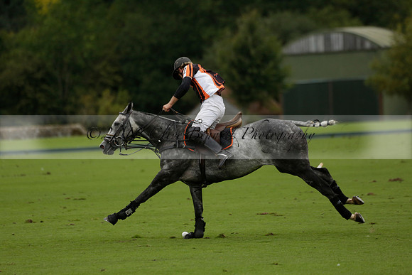 Four Quarters Black (black) v Clashleigh (red) in the Autumn Cup subsidiary final polo match on Ambersham 2 at Cowdray Park Polo Club on Sunday 22 September 2013 www.polopictures.co.uk