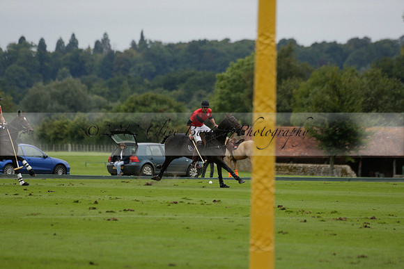 Four Quarters Black (black) v Clashleigh (red) in the Autumn Cup subsidiary final polo match on Ambersham 2 at Cowdray Park Polo Club on Sunday 22 September 2013 www.polopictures.co.uk