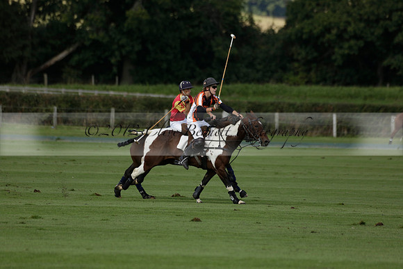 Four Quarters Black (black) v BHC (red) in a Autumn Cup polo match on Ambersham 2 at Cowdray Park Polo Club on Friday 20 September 2013 www.polopictures.co.uk