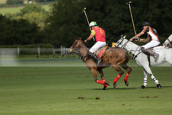 Four Quarters Black (black) v BHC (red) in a Autumn Cup polo match on Ambersham 2 at Cowdray Park Polo Club on Friday 20 September 2013 www.polopictures.co.uk