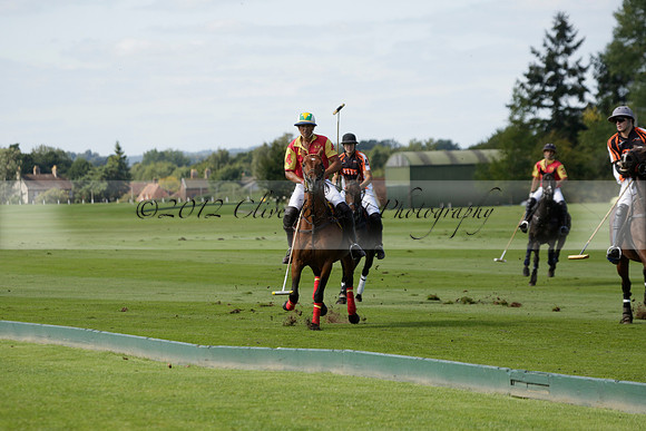 Four Quarters Black (black) v BHC (red) in a Autumn Cup polo match on Ambersham 2 at Cowdray Park Polo Club on Friday 20 September 2013 www.polopictures.co.uk