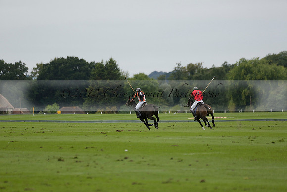 Four Quarters Black (black) v Clashleigh (red) in the Autumn Cup subsidiary final polo match on Ambersham 2 at Cowdray Park Polo Club on Sunday 22 September 2013 www.polopictures.co.uk
