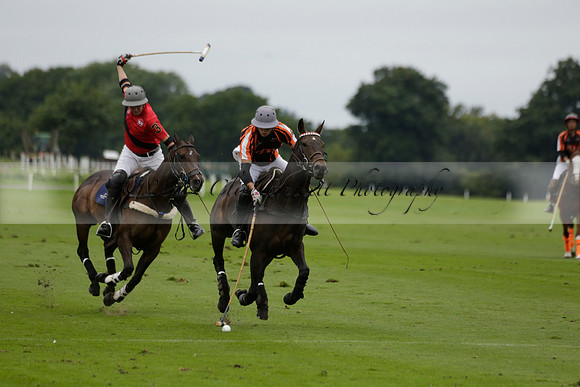 Four Quarters Black (black) v Clashleigh (red) in the Autumn Cup subsidiary final polo match on Ambersham 2 at Cowdray Park Polo Club on Sunday 22 September 2013 www.polopictures.co.uk