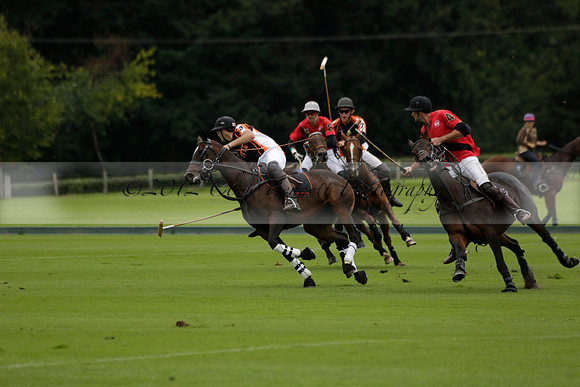 Four Quarters Black (black) v Clashleigh (red) in the Autumn Cup subsidiary final polo match on Ambersham 2 at Cowdray Park Polo Club on Sunday 22 September 2013 www.polopictures.co.uk