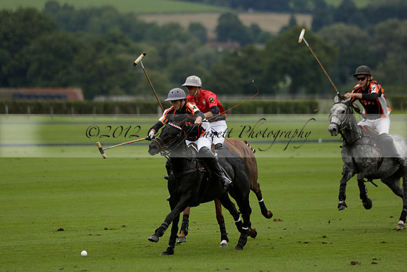 Four Quarters Black (black) v Clashleigh (red) in the Autumn Cup subsidiary final polo match on Ambersham 2 at Cowdray Park Polo Club on Sunday 22 September 2013 www.polopictures.co.uk