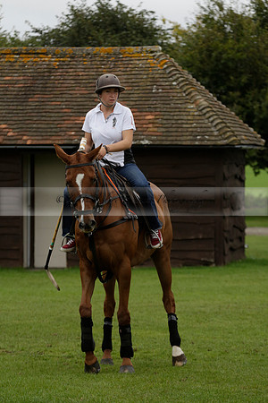 Four Quarters Black (black) v Clashleigh (red) in the Autumn Cup subsidiary final polo match on Ambersham 2 at Cowdray Park Polo Club on Sunday 22 September 2013 www.polopictures.co.uk