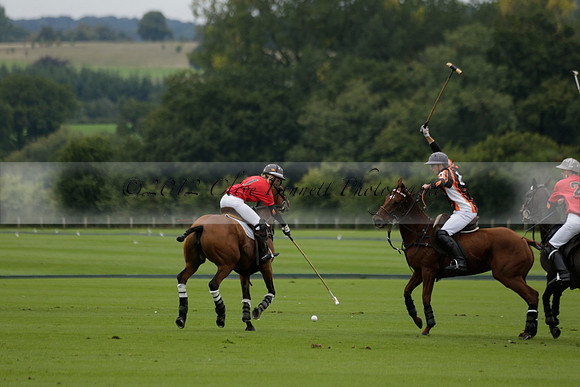 Four Quarters Black (black) v Clashleigh (red) in the Autumn Cup subsidiary final polo match on Ambersham 2 at Cowdray Park Polo Club on Sunday 22 September 2013 www.polopictures.co.uk