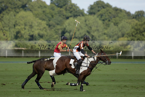 Four Quarters Black (black) v BHC (red) in a Autumn Cup polo match on Ambersham 2 at Cowdray Park Polo Club on Friday 20 September 2013 www.polopictures.co.uk