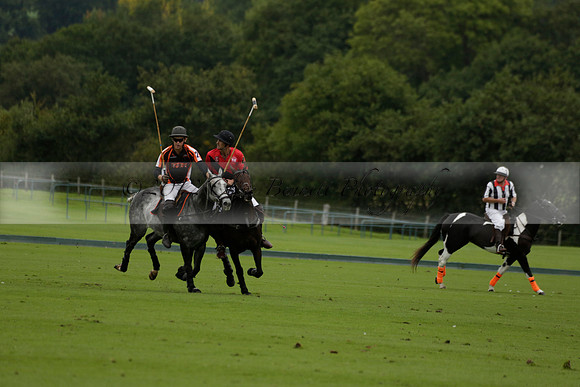 Four Quarters Black (black) v Clashleigh (red) in the Autumn Cup subsidiary final polo match on Ambersham 2 at Cowdray Park Polo Club on Sunday 22 September 2013 www.polopictures.co.uk