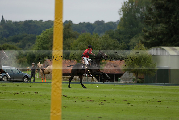 Four Quarters Black (black) v Clashleigh (red) in the Autumn Cup subsidiary final polo match on Ambersham 2 at Cowdray Park Polo Club on Sunday 22 September 2013 www.polopictures.co.uk