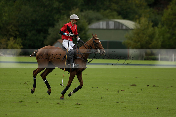 Four Quarters Black (black) v Clashleigh (red) in the Autumn Cup subsidiary final polo match on Ambersham 2 at Cowdray Park Polo Club on Sunday 22 September 2013 www.polopictures.co.uk