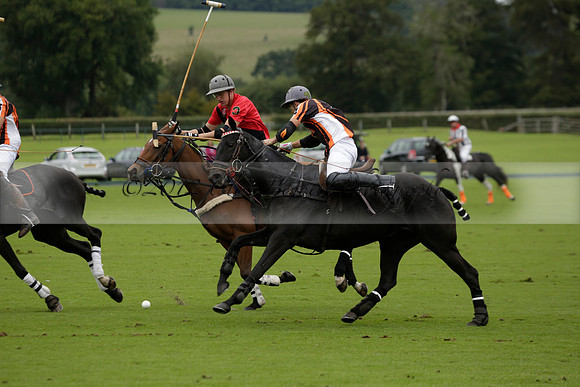 Four Quarters Black (black) v Clashleigh (red) in the Autumn Cup subsidiary final polo match on Ambersham 2 at Cowdray Park Polo Club on Sunday 22 September 2013 www.polopictures.co.uk