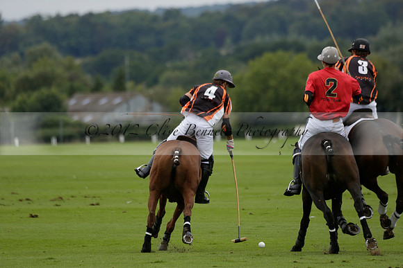 Four Quarters Black (black) v Clashleigh (red) in the Autumn Cup subsidiary final polo match on Ambersham 2 at Cowdray Park Polo Club on Sunday 22 September 2013 www.polopictures.co.uk
