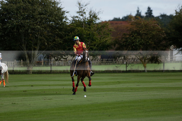 Four Quarters Black (black) v BHC (red) in a Autumn Cup polo match on Ambersham 2 at Cowdray Park Polo Club on Friday 20 September 2013 www.polopictures.co.uk