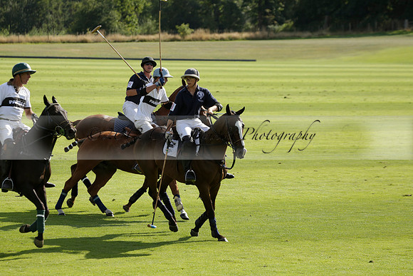 Pandas (white) v Home Farm (navy) in a Park House West Sussex Cup Polo match on Brooksfield at Cowdray Park Polo Club on Friday 30 August 2013. 2013.08.30 www.polopictures.co.uk