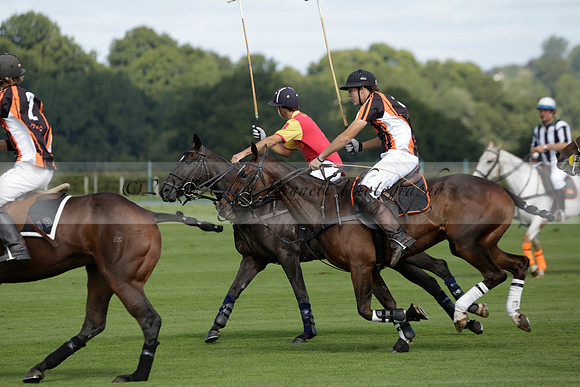 Four Quarters Black (black) v BHC (red) in a Autumn Cup polo match on Ambersham 2 at Cowdray Park Polo Club on Friday 20 September 2013 www.polopictures.co.uk