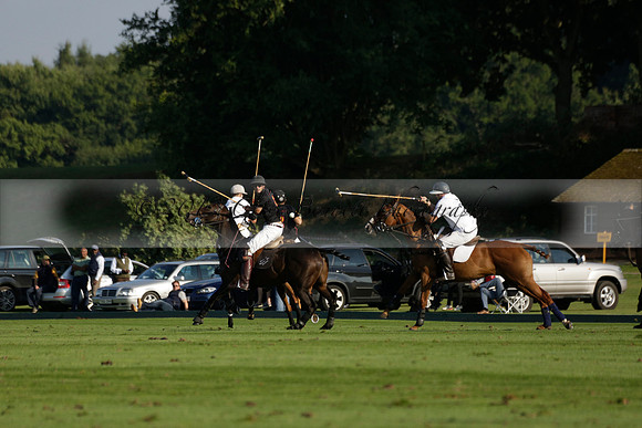Pluma Negra (white) v Shoreline (black) in the Brecknock Cup Subsidiary final polo match played on Sunday 25 August 2013 at Cowdray Park Polo Club on Ambersham 1. 2013.10.12 www.polopictures.co.uk