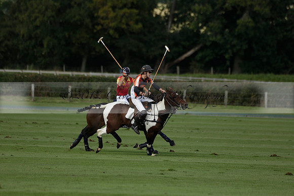Four Quarters Black (black) v BHC (red) in a Autumn Cup polo match on Ambersham 2 at Cowdray Park Polo Club on Friday 20 September 2013 www.polopictures.co.uk