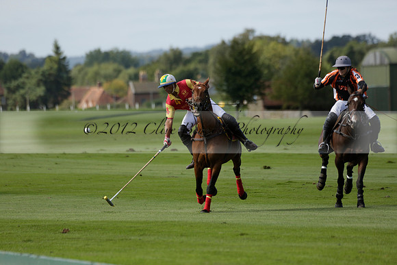 Four Quarters Black (black) v BHC (red) in a Autumn Cup polo match on Ambersham 2 at Cowdray Park Polo Club on Friday 20 September 2013 www.polopictures.co.uk
