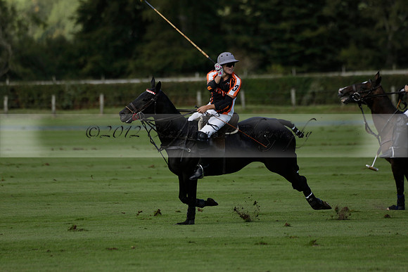 Four Quarters Black (black) v BHC (red) in a Autumn Cup polo match on Ambersham 2 at Cowdray Park Polo Club on Friday 20 September 2013 www.polopictures.co.uk