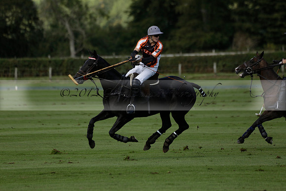 Four Quarters Black (black) v BHC (red) in a Autumn Cup polo match on Ambersham 2 at Cowdray Park Polo Club on Friday 20 September 2013 www.polopictures.co.uk