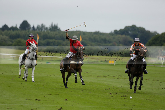 Four Quarters Black (black) v Clashleigh (red) in the Autumn Cup subsidiary final polo match on Ambersham 2 at Cowdray Park Polo Club on Sunday 22 September 2013 www.polopictures.co.uk