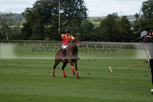 Four Quarters Black (black) v BHC (red) in a Autumn Cup polo match on Ambersham 2 at Cowdray Park Polo Club on Friday 20 September 2013 www.polopictures.co.uk