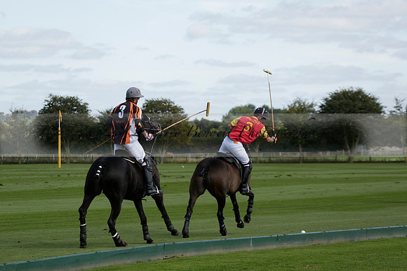 Four Quarters Black (black) v BHC (red) in a Autumn Cup polo match on Ambersham 2 at Cowdray Park Polo Club on Friday 20 September 2013 www.polopictures.co.uk