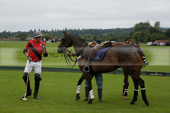 Four Quarters Black (black) v Clashleigh (red) in the Autumn Cup subsidiary final polo match on Ambersham 2 at Cowdray Park Polo Club on Sunday 22 September 2013 www.polopictures.co.uk