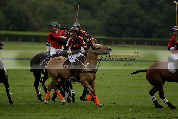 Four Quarters Black (black) v Clashleigh (red)in a Jaeger Le Coultre Autumn Cup polo match played on Ambersham 2 at Cowdray Park Polo Club on Wednesday 2013.09.11 www.polopictures.co.uk