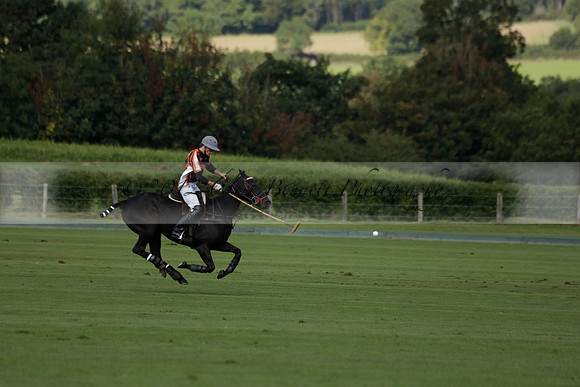 Four Quarters Black (black) v BHC (red) in a Autumn Cup polo match on Ambersham 2 at Cowdray Park Polo Club on Friday 20 September 2013 www.polopictures.co.uk