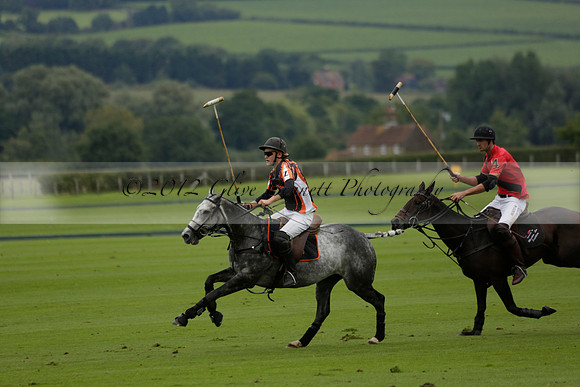 Four Quarters Black (black) v Clashleigh (red) in the Autumn Cup subsidiary final polo match on Ambersham 2 at Cowdray Park Polo Club on Sunday 22 September 2013 www.polopictures.co.uk