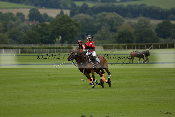 Four Quarters Black (black) v Clashleigh (red) in the Autumn Cup subsidiary final polo match on Ambersham 2 at Cowdray Park Polo Club on Sunday 22 September 2013 www.polopictures.co.uk