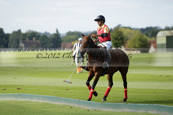Four Quarters Black (black) v BHC (red) in a Autumn Cup polo match on Ambersham 2 at Cowdray Park Polo Club on Friday 20 September 2013 www.polopictures.co.uk