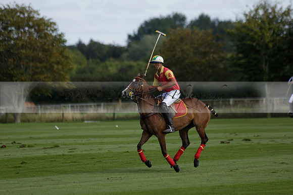 Four Quarters Black (black) v BHC (red) in a Autumn Cup polo match on Ambersham 2 at Cowdray Park Polo Club on Friday 20 September 2013 www.polopictures.co.uk