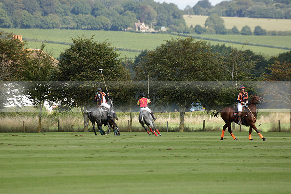 Four Quarters Black (black) v BHC (red) in a Autumn Cup polo match on Ambersham 2 at Cowdray Park Polo Club on Friday 20 September 2013 www.polopictures.co.uk