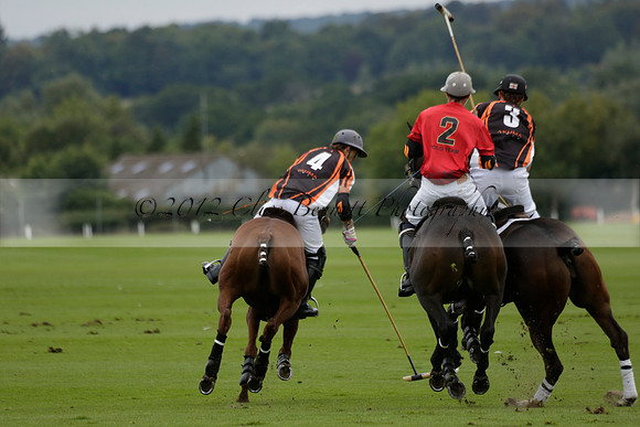 Four Quarters Black (black) v Clashleigh (red) in the Autumn Cup subsidiary final polo match on Ambersham 2 at Cowdray Park Polo Club on Sunday 22 September 2013 www.polopictures.co.uk