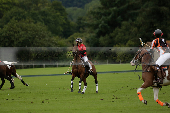 Four Quarters Black (black) v Clashleigh (red) in the Autumn Cup subsidiary final polo match on Ambersham 2 at Cowdray Park Polo Club on Sunday 22 September 2013 www.polopictures.co.uk