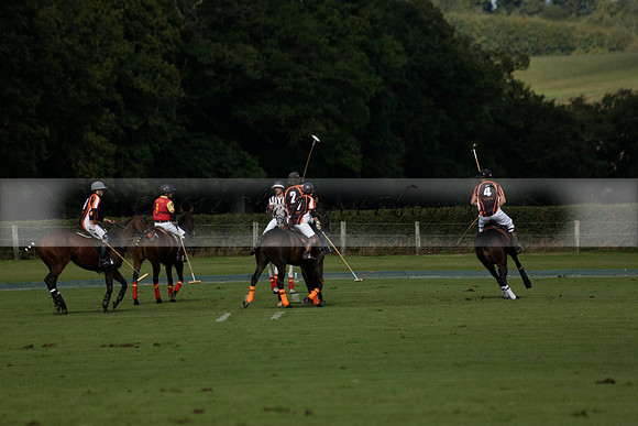 Four Quarters Black (black) v BHC (red) in a Autumn Cup polo match on Ambersham 2 at Cowdray Park Polo Club on Friday 20 September 2013 www.polopictures.co.uk