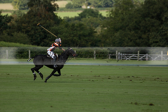 Four Quarters Black (black) v BHC (red) in a Autumn Cup polo match on Ambersham 2 at Cowdray Park Polo Club on Friday 20 September 2013 www.polopictures.co.uk