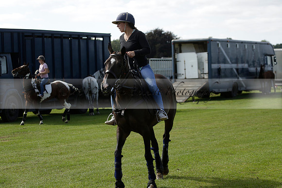 Four Quarters Black (black) v BHC (red) in a Autumn Cup polo match on Ambersham 2 at Cowdray Park Polo Club on Friday 20 September 2013 www.polopictures.co.uk