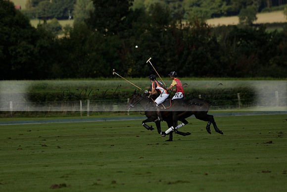 Four Quarters Black (black) v BHC (red) in a Autumn Cup polo match on Ambersham 2 at Cowdray Park Polo Club on Friday 20 September 2013 www.polopictures.co.uk
