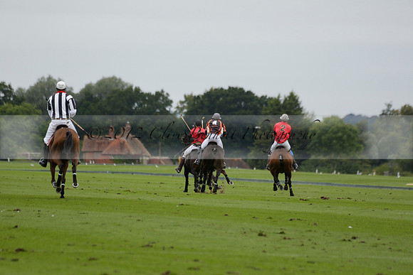 Four Quarters Black (black) v Clashleigh (red) in the Autumn Cup subsidiary final polo match on Ambersham 2 at Cowdray Park Polo Club on Sunday 22 September 2013 www.polopictures.co.uk